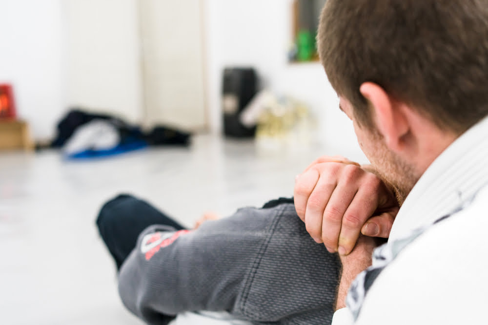 Man demonstrating a grappling joint lock technique as part of self defense practice - Self Defense